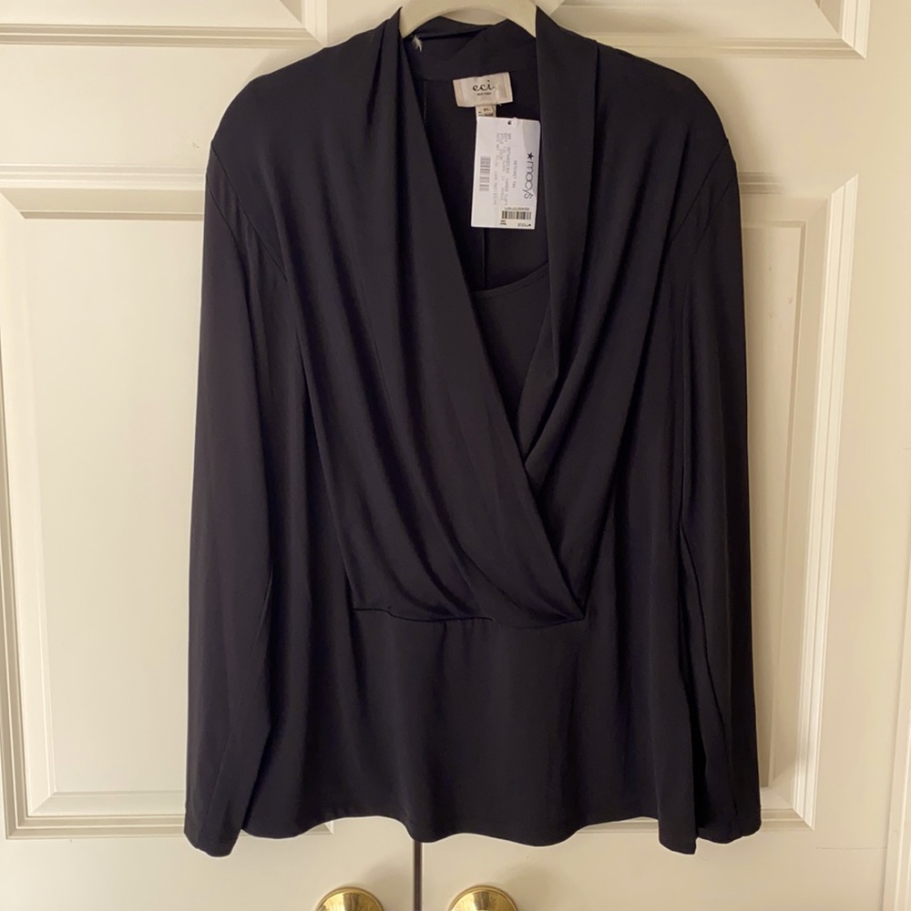Black, long sleeved, rolled necklines knit top -lots of-stretch. Never worn.